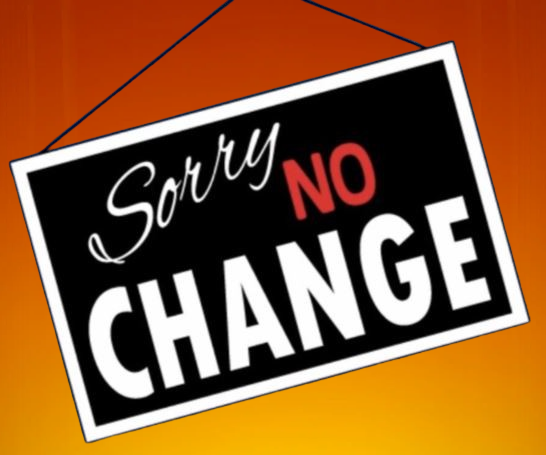 Black, red and white sign reading “Sorry No Change” on an orange background